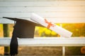 Graduation cap, Hat with degree paper on white wood table, abstract light background Empty ready for your product display or mont Royalty Free Stock Photo