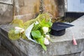 Graduation cap or mortaboard with a bunch of roses on the old stairs  in the graduation day Royalty Free Stock Photo