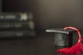 Graduation cap with pile of books on the background. With copy space Royalty Free Stock Photo