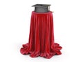 Graduation cap on table covered cloth