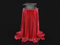 Graduation cap on table covered cloth