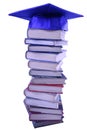 Graduation cap on top of book stack