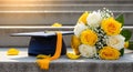 Graduation Cap and Yellow Roses on Steps Royalty Free Stock Photo
