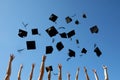 Graduation Caps Thrown in the Air on blue sky