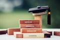 Graduation celebrating cap on wooden square blocks tower. Blank space for letter e.g education, success, graduate, etc. Ideas for Royalty Free Stock Photo