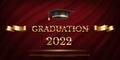 2022 graduation ceremony banner. Award concept with academic hat, golden ribbon and text on dark red curtain background. Royalty Free Stock Photo
