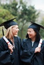 Graduation, certificate and diversity with student friends outdoor on campus for ceremony at university. Education Royalty Free Stock Photo