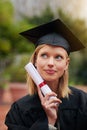 Graduation, certificate and future with student woman outdoor on campus for university or college event. Thinking Royalty Free Stock Photo