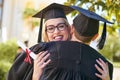 Graduation day is a day for celebrating. a young couple embracing each other on graduation day. Royalty Free Stock Photo