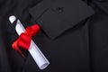 Graduation Day. A gown, graduation cap, and diploma and laid out ready for graduation day Royalty Free Stock Photo