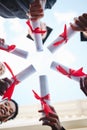 Graduation, diploma and hands with a student group outside in a huddle or circle from below. Graduate, success and Royalty Free Stock Photo