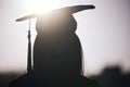 Graduation, education and silhouette of a student woman outdoor on university campus with lens flare. Future, college Royalty Free Stock Photo