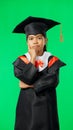 Graduation, education and thinking child on green screen for graduate, academy ceremony and award. Primary school