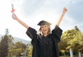 Graduation event, portrait and happy woman celebrate achievement, success and smile. Excited graduate, education