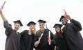 Graduation, friends and portrait of students with success, education award and achievement in college. School, graduate
