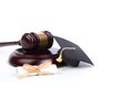 Graduation Hat with Diploma,Judge gavel on white background Royalty Free Stock Photo