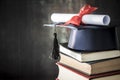 Graduation hat and diploma on table Royalty Free Stock Photo