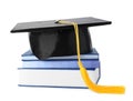 Graduation hat with gold tassel and stack of books Royalty Free Stock Photo