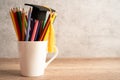 Graduation hat with pencil in cup with copy space Royalty Free Stock Photo