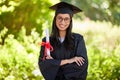 Graduation, Indian woman and portrait for diploma, education and success for university. Cap, gown and ceremony for