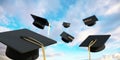 Graduation. Mortarboards fly on blue sky. College and high school students throw caps