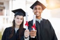 Graduation portrait, diploma and couple of friends in college, education success and achievement or scholarship. Award Royalty Free Stock Photo