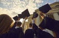 Graduation student with hat over sunset and university building bottom view Royalty Free Stock Photo