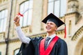 Graduation: Student Standing With Diploma