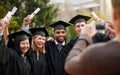 Graduation, success and photograph of student friends outdoor on campus at university or college. Education, certificate