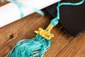 a 2023 graduation tassel on wood