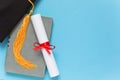 Graduation top view concept on blue background Royalty Free Stock Photo