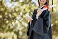 Graduation, university diploma and girl with phone on campus smile for success, award and achievement. Education