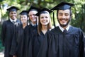 Graduation, university and man for portrait, ceremony and friends for education and college for diploma. Outdoor, degree