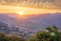 graet highland landscape with scenic view from mountain to below to a walley with majectic mountains and scenic cloudy sunset on