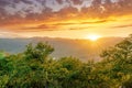 graet highland landscape with scenic view from mountain to below to a walley with majectic mountains and scenic cloudy sunset on