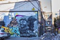 Graffiti in an alley in the Kensington Market. Street art or mural painting on display at Toronto`s Graffiti Alley Royalty Free Stock Photo