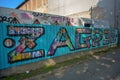 Graffiti art in capital city of Croatia. Colorful name of the town Zagreb on a metal wall next to a sidewalk