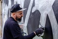 Graffiti artist in action. Royalty Free Stock Photo