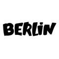 graffiti Berlin word sprayed in black over white.