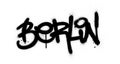 Graffiti Berlin word sprayed in black over white
