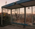 Graffiti blown glass bus stop. Industrial district in Croatia