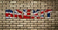 Graffiti BREXIT on the brick wall