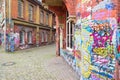 Graffiti brick wall art scale alley in germany Royalty Free Stock Photo