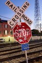 Graffiti clad stop sign on the river walk in New Orleans - vertical shot