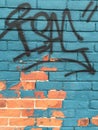 Graffiti colored brick wall