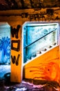 Graffiti in a dark pedestrian tunnel, in Philadelphia, Pennsylvania.