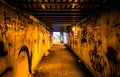 Graffiti in a dark pedestrian tunnel, in Philadelphia, Pennsylvania.