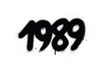 Graffiti 1989 date sprayed in black over white