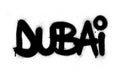 Graffiti Dubai word sprayed in black over white