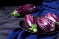 Graffiti eggplants on the black plate Royalty Free Stock Photo